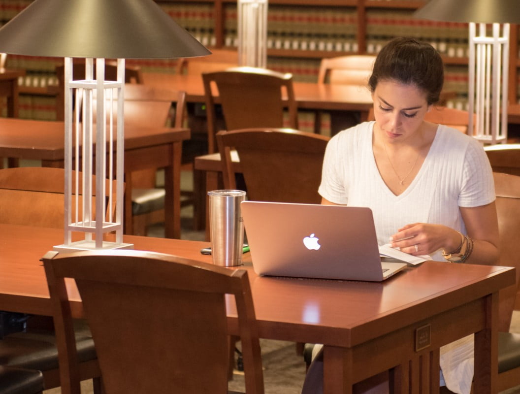 young woman on a computer in the library