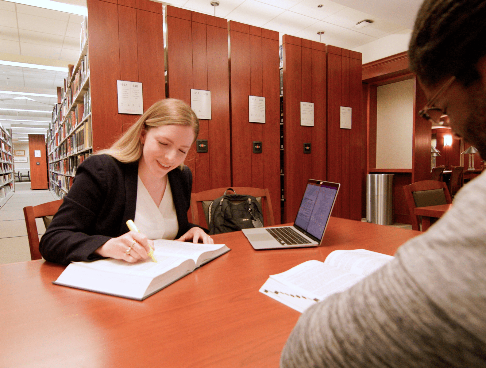 Photo of a small group of students speaking with an employer during an On-Campus interview event